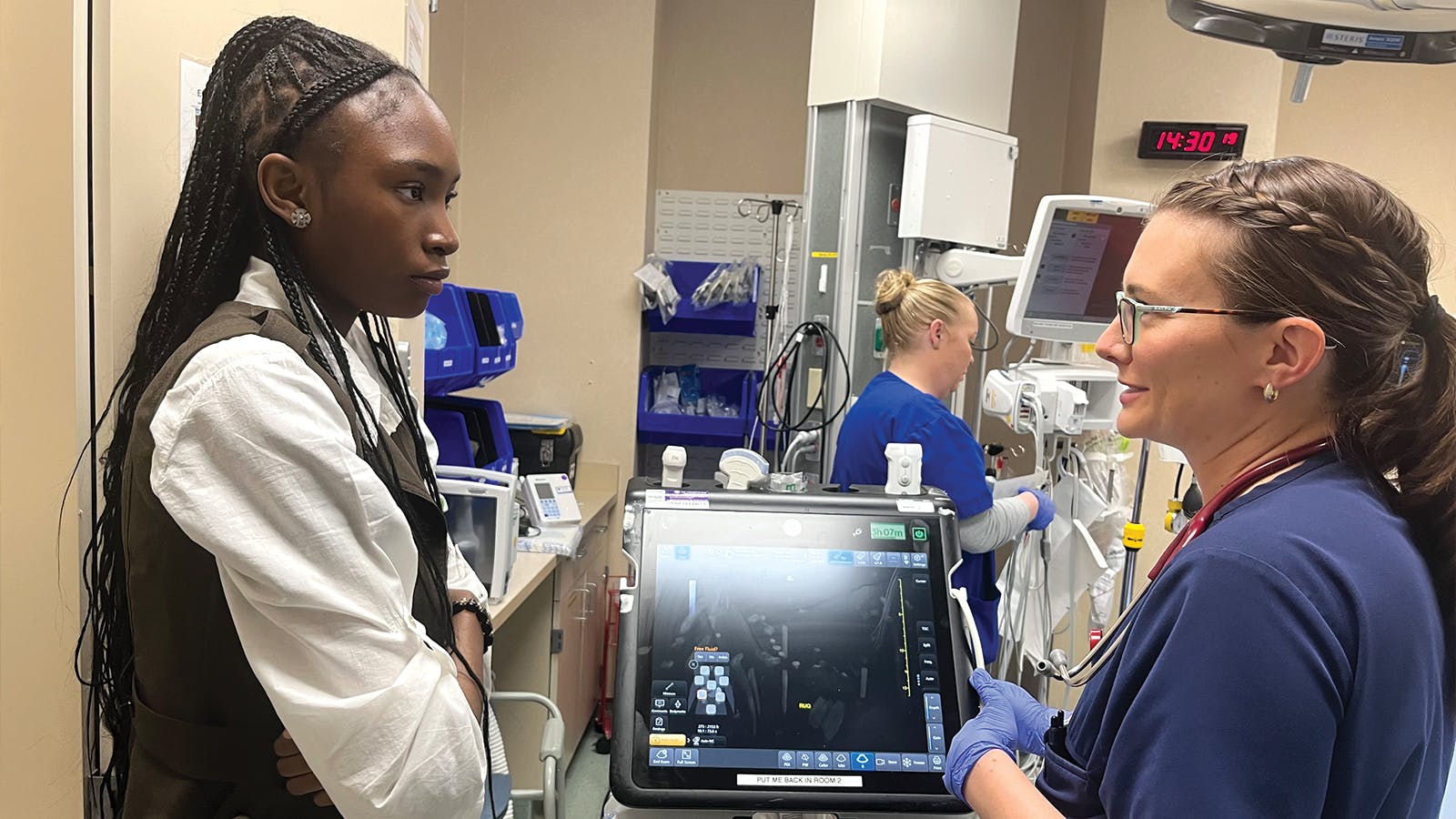 A doctor speaking with a young lady